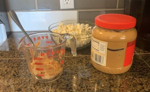 Ingredients for making peanut butter popcorn. You will need bowls and something to heat up the peanut butter.