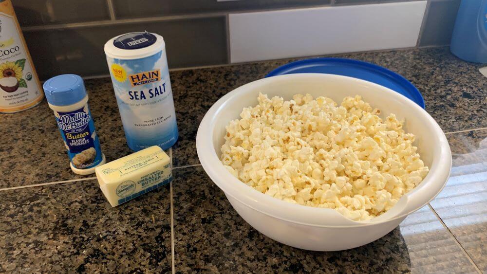 A bowl of perfectly cooked microwave popcorn in my homemade popcorn popper.