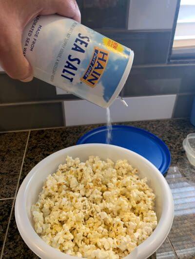Seasoning my popcorn with salt. Seasoning my popcorn with HAIN Sea Salt.